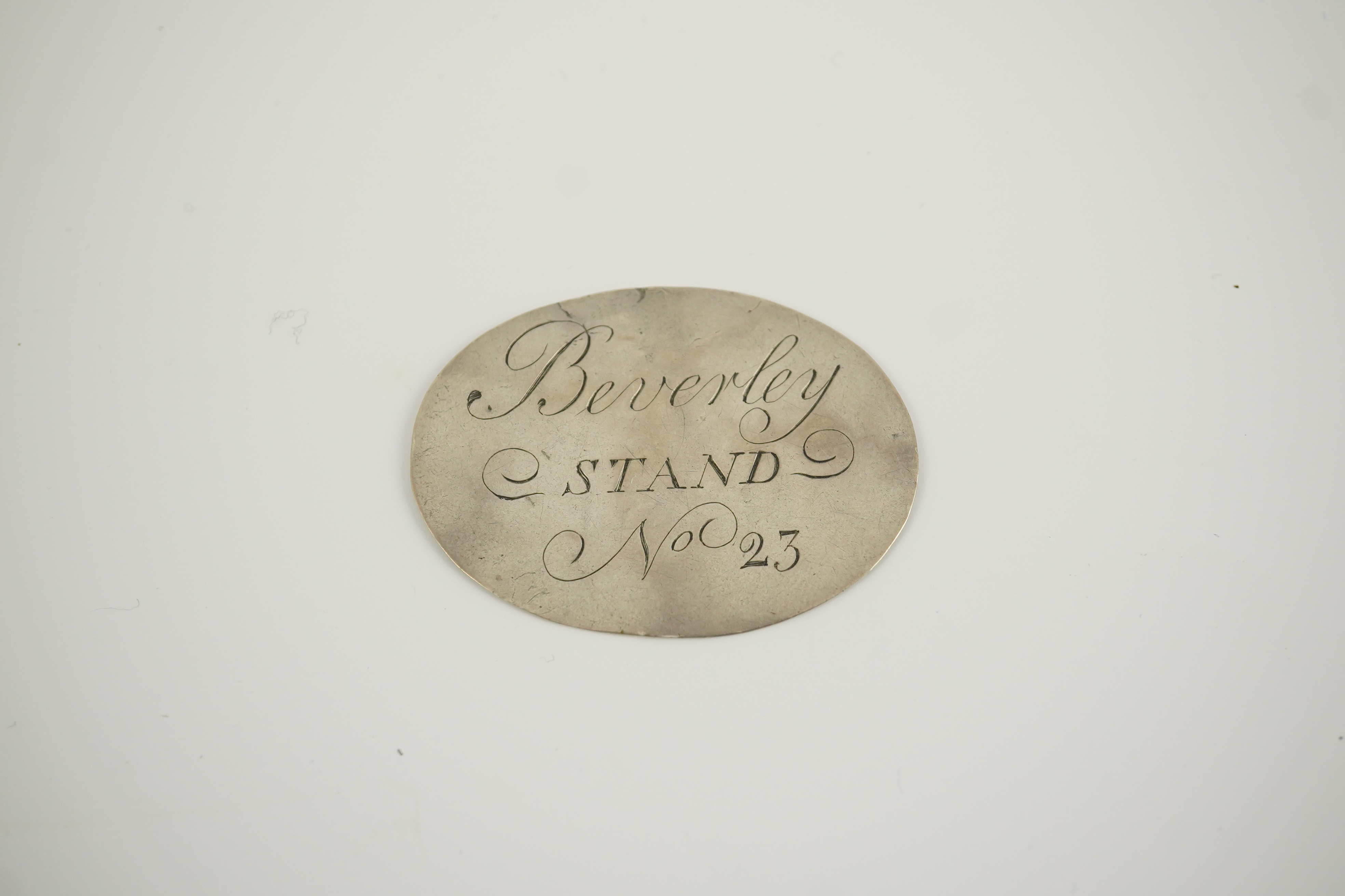 A George III silver Beverley Racecourse Members ticket, inscribed 'Beverley STAND No 23' to one side, monogrammed and dated 1767 the other, 4.4cm.